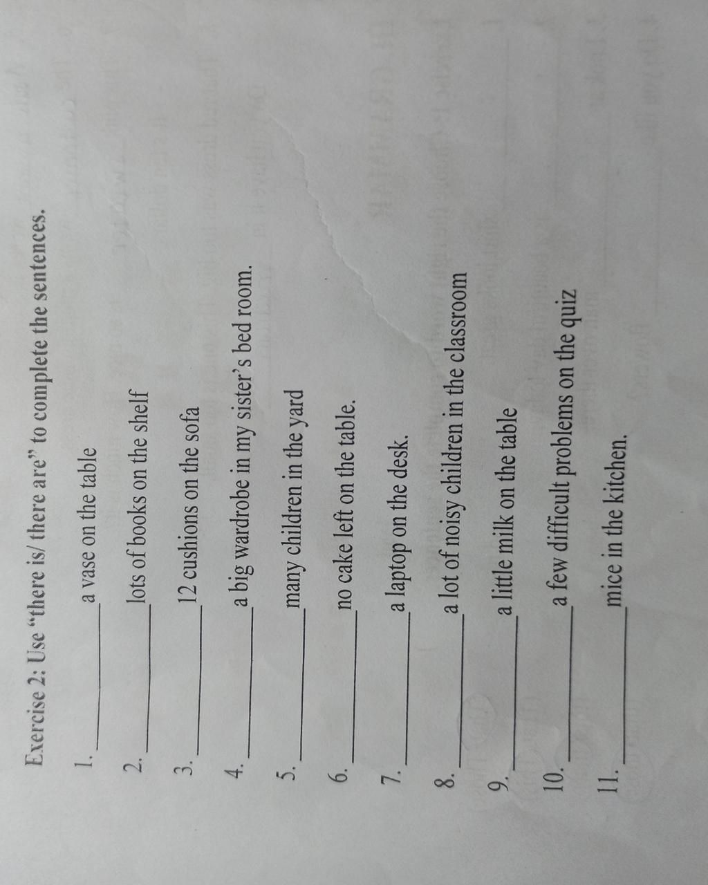 Exercise 2 Use "there is/ there are" to complete the sentences. a vase